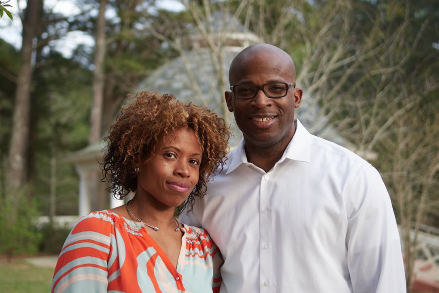 The parents close together, warm afternoon light.