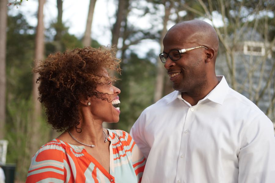 The parents in profile, facing each other.