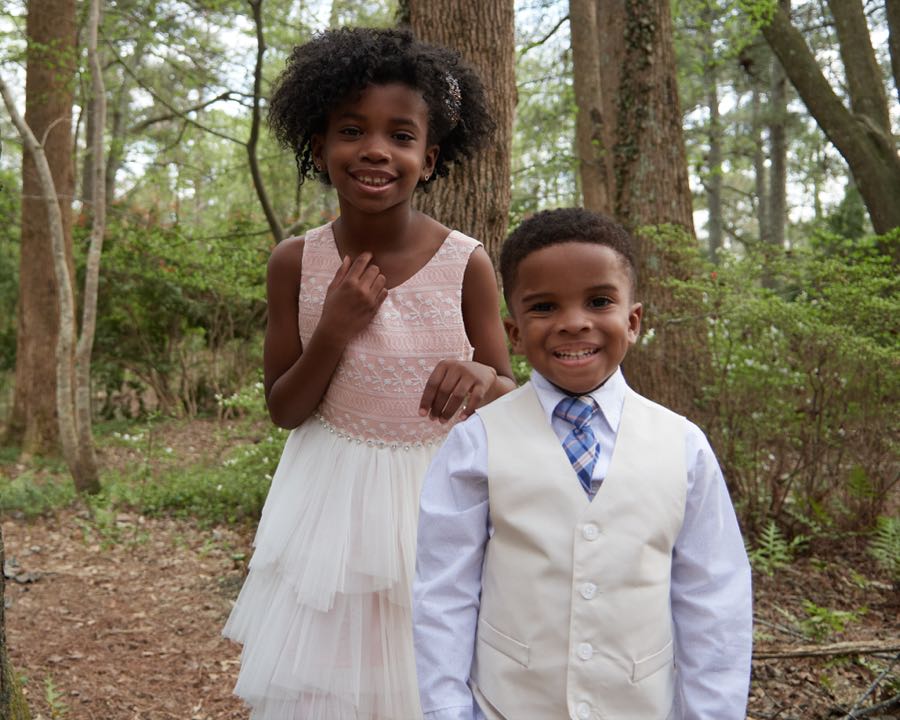The two children standing together for a portrait.